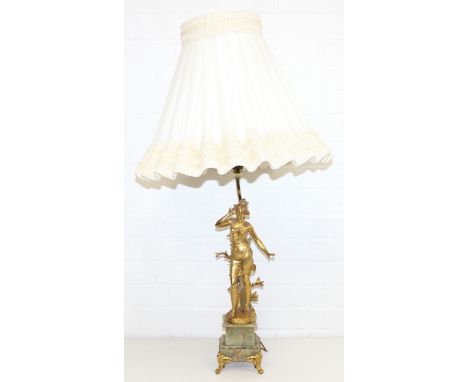 A vintage Ormolu or gilt metal figural lamp on green onyx base, with gilt brass legs and decorative white/cream shade, figure