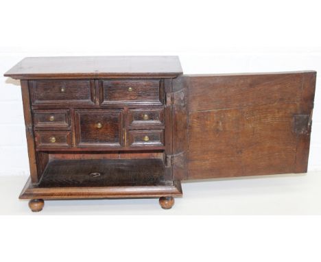 An antique oak and walnut with sycamore banding spice cupboard, in part Queen Anne period c.1700 with believed to be later oa