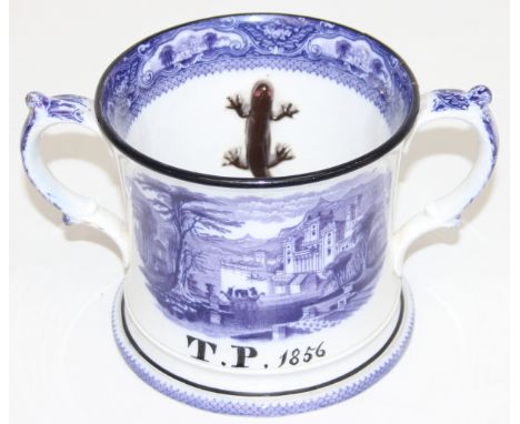 A mid-19th century Staffordshire Pearlware twin-handled tankard/loving cup, showing a blue and white willow transfer design, 