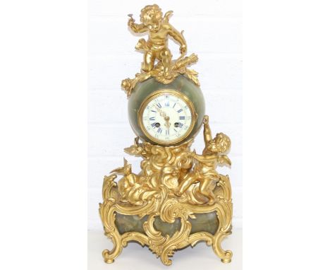 A.D. Mougin of Montbeliard &amp; Paris - a highly decorative ormolu clock adorned with gilded cherubs and birds, with green o