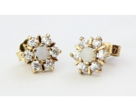 A pair of floral effect 9ct gold, opal and white stone earrings, seemingly unmarked but XRF confirmed, 1.38g