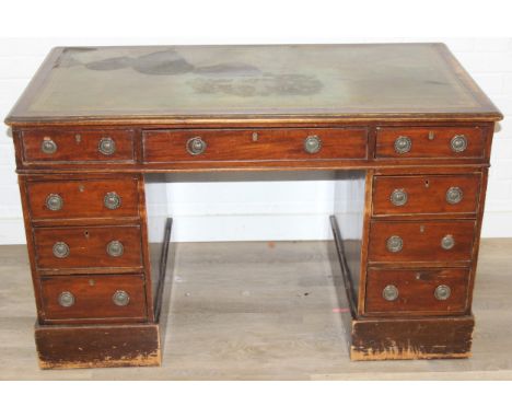 An early 20th century three part pedestal desk with inset green leather top, 119cm x 66cm x 72cm