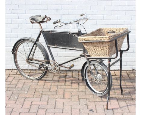 A vintage Pashley style butchers or shop bicycle with small front wheel, seemingly unbranded but with Brooks saddle, wicker b