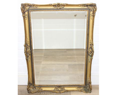 Ornate gilt-framed bevel-edged wall mirror, 80cm x 57cm