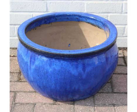 A large blue glazed garden planter or pot, 50cm in diameter x 32cm tall