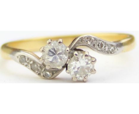 [2.71g, P] - an 18ct yellow gold and diamond ring, two larger diamonds in crossover setting with diamond set shoulders, the t