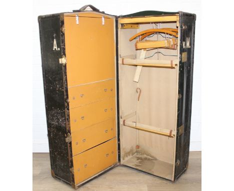Campaign wardrobe trunk with various travel stickers, approx 60cm x 54cm x 131cm