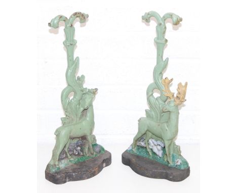 Two vintage painted cast iron door stops or door porters formed as deers or stags with decorative handles, early-mid 20th cen