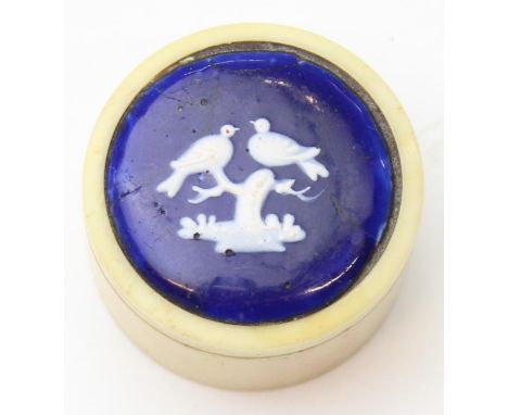 A very unusual antique pill or patch box of turned bone construction with inlaid enamel plaque to the top, the blue and white