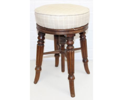 An antique piano stool with adjustable twist top height, 34cm in diameter x 49cm tall