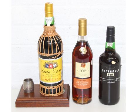 A bottle of Famille Esteve Cognac, 70cl, 75cl 10 year old port, and a bottle of Santa Luiza Madeira, 1 litre, with wooden sta