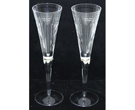 A pair of silver and crystal champagne flutes, the silver band marked for Sheffield 2006 by Carrs, boxed, each 27cm tall [2]