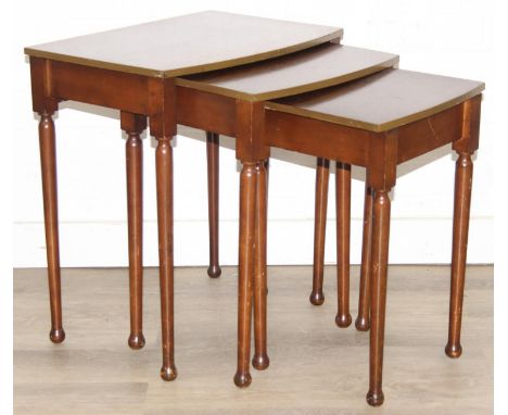Oak nest of tables with bow fronts, the largest 50cm x 36cm x 55cm