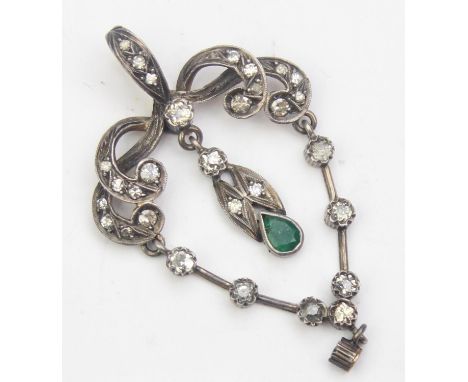 An Art Nouveau period Belle Époque diamond and emerald pendant, a central pear shaped emerald surrounded by many small diamon