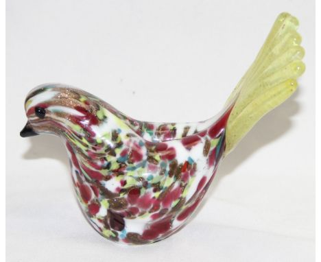 A vintage glass bird with colourful glass body and golden tail, likely by Murano, remnants of label to base, approx 11cm wide