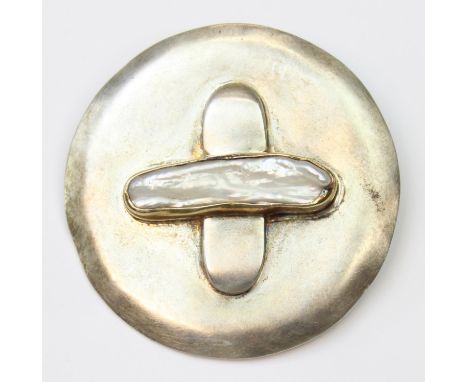 A retro Brutalist brooch or pendant set with mother of pearl, indistinctly marked but XRF confirmed as silver, seemingly hand