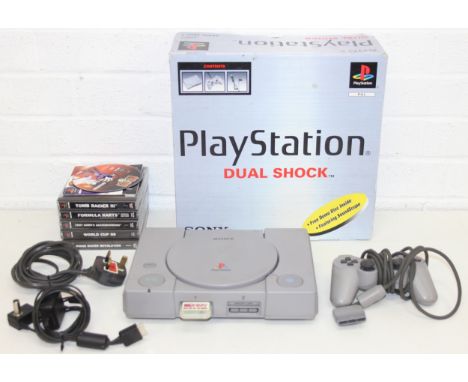 Dual Shock Sony Play Station SCPH-7052 B with original box and a selection of games to incl Tomb Raider III, World Cup '98 et