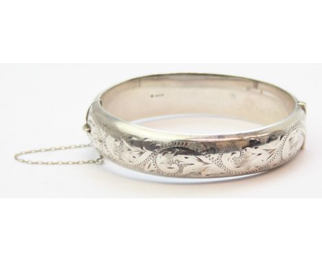 A retro silver cuff bangle or bracelet with engraved decoration, Sheffield 1988 by unknown NC, 21.73g