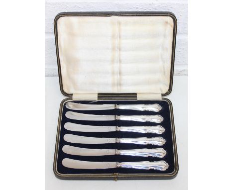 A boxed set of six silver handled butter knives, the handles marked for Sheffield 1924 by Harrison Brothers &amp; Howson, mar