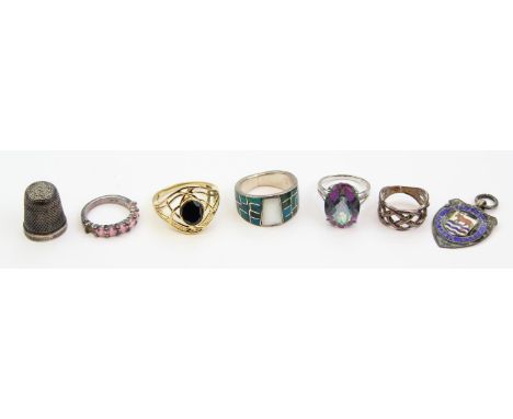 Five assorted silver and silver gilt rings, four marked and XRF confirmed, a silver thimble and a silver and enamel fob for O
