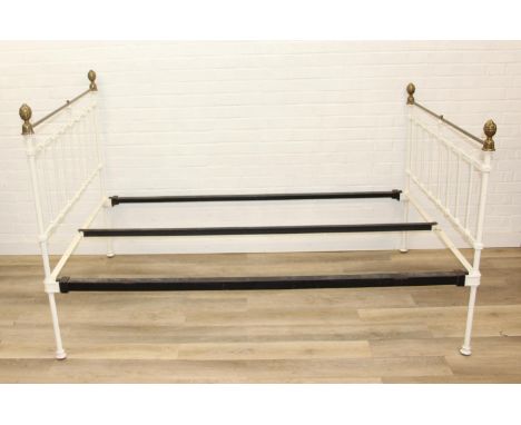 A vintage white painted cast iron and brass small double bed frame, likely late Victorian, 122cm x 200cm x 123cm