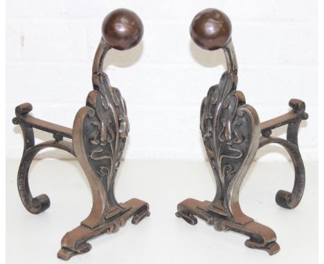Pair of Art Nouveau cast iron and copper firedogs or andirons, bearing number 404940 verso, in the manner of Christopher Dres