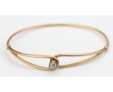 [7.54g] - an antique 15ct gold and diamond torque bracelet, the solitaire diamond assessed as 0.4ct, the bracelet unmarked ap