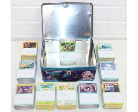 Pokémon tin with 10 bundles of 100 collectors' trading cards (1000)&nbsp;all character cards