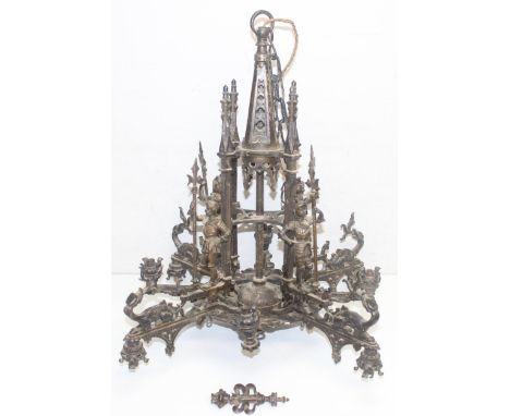 A highly impressive Neo Gothic chandelier with patinated finish, made from a bronze-like copper alloy, 8 alternating arms of 