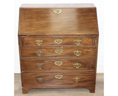 A Georgian mahogany bureau with four drawers, brass handles, fall down front with fitted interior, 90cm x 52cm x 101cm