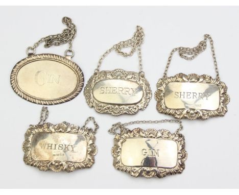 Five assorted silver and silver plated decanter labels, two silver to inc Whisky &amp; Sherry, and three other silver plated 