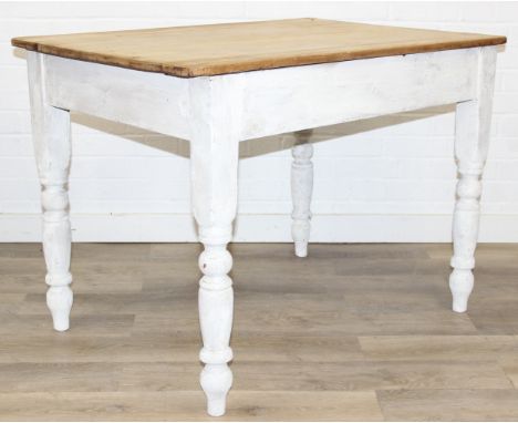 An antique pine farmhouse table with distressed white painted base and turned legs, 106cm x 72cm x 76cm