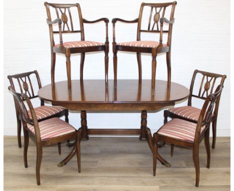 A Georgian style mahogany dining table with brass paw feet and a set of six matching dining chairs, 20th century, 153cm x 89c
