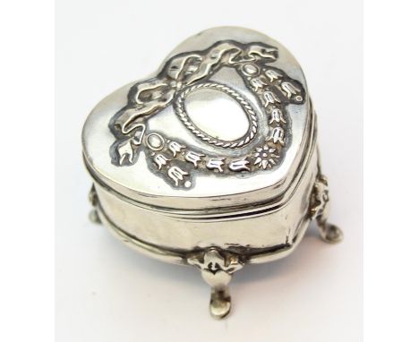 A small silver heart shaped trinket or ring box on pad feet, embossed top, Birmingham 1906 by Henry Matthews, 46mm wide
