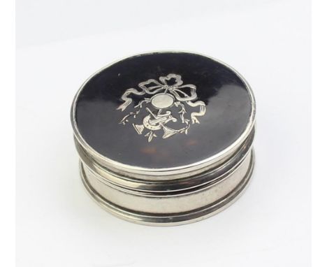An antique silver and tortoiseshell pill box with marked for Birmingham 1905 by Cohen &amp; Charles, gilt lined interior, 47m