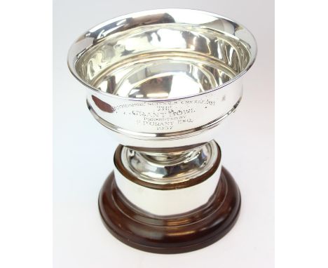 [513.44g] - a large silver trophy bowl on stand, marked for London 1909, the makers mark poorly struck, with silver band to t