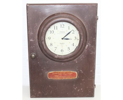 A modern industrial style painted metal wall cabinet with inset clock, the dial marked for J. Pascal of Paris, the cabinet ma
