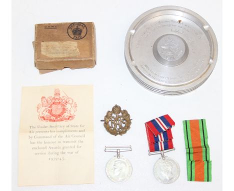 A boxed pair of WW2 medals, the box named to J Knott of Kidderminster, with Air Council paperwork, RAF badge with King's Crow