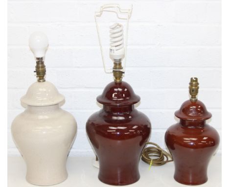 Three glazed ceramic lamp bases, 2 red/brown and 1 cream, tallest 40cm [3]