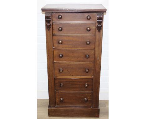 An antique mahogany Wellington chest, seven drawers with turned handles and carved details to pillars, with key, 53cm x 37cm 