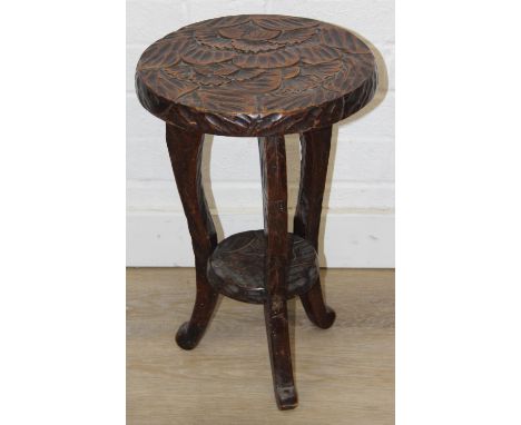 An Arts &amp; Crafts period Japanese carved side table, likely by Liberty &amp; Co but unmarked, 30cm in diameter x 46cm tall