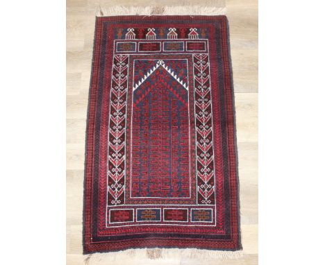 A vintage Afghan Balucch prayer rug of red ground, 155cm x 86cm