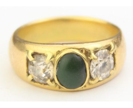[9.18g, Q] - an vintage 18ct gold ring set with two large diamonds flanking a central green cabochon stone believed to be Jad