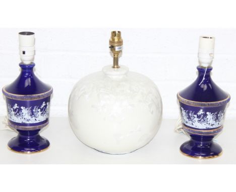 Three glazed ceramic lamp bases to incl a pair of classical style table lamps with white figural transfer on deep cobalt blue