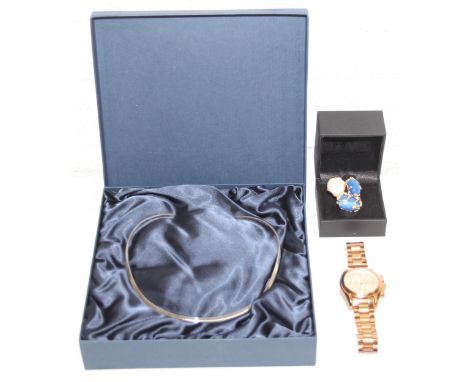 A silver Torque necklace by Gavin Shelley of Durham, a gold plated Michael Kors watch, and a retro style gold plated dress ri