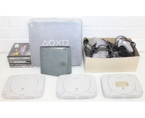 Qty of Sony Play Station items to incl 3 PS One (slim) consoles, control pads, and games