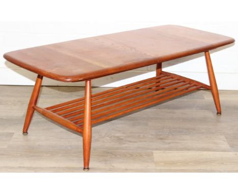 A retro Ercol coffee table with magazine rack, golden dawn type finish, 104cm x 45cm x 37cm
