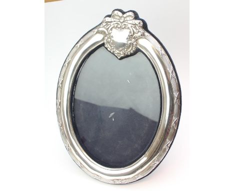 A large silver mounted photograph frame with vacant cartouche, oval shape, marked for London 1993 by Keyford Frames Ltd, 30cm
