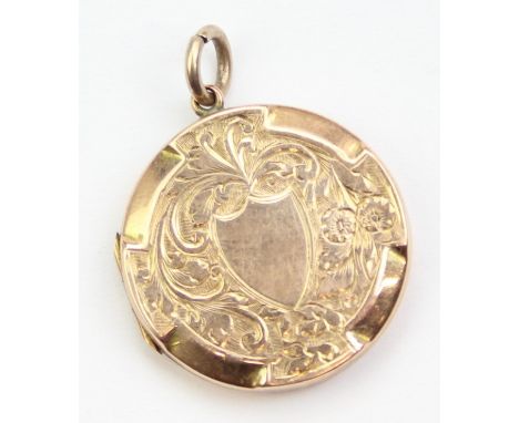 9ct gold back &amp; front locket and a 9ct gold charm formed as the letter M, the locket 26mm in diameter, both items 4.93g [
