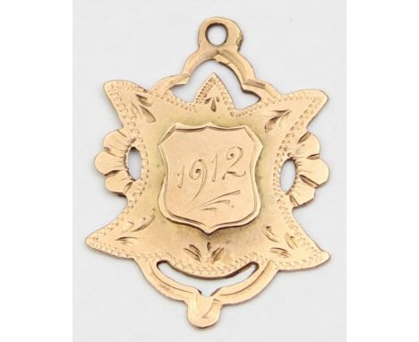 [1.89g] - an antique 9ct gold fob medal engraved for 1912, marked for Chester 1907, 27mm x 21mm